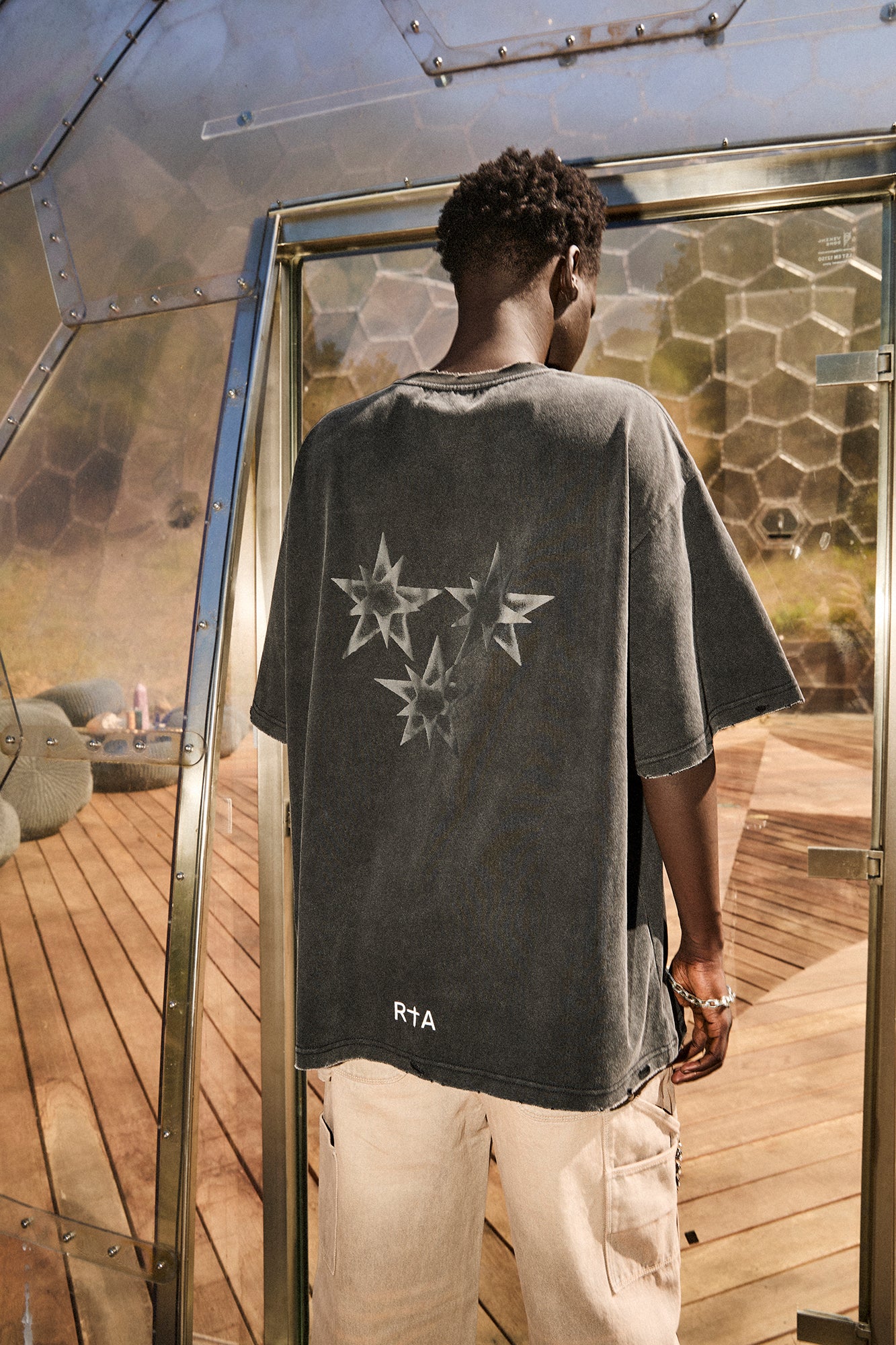 Black Cotton Oversized Tee with Star Graphics - Back View On Model | RTA