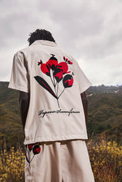 Beige Nathan Short Sleeve Shirt with Red Poppy Print - Back View Outdoor Setting | RTA