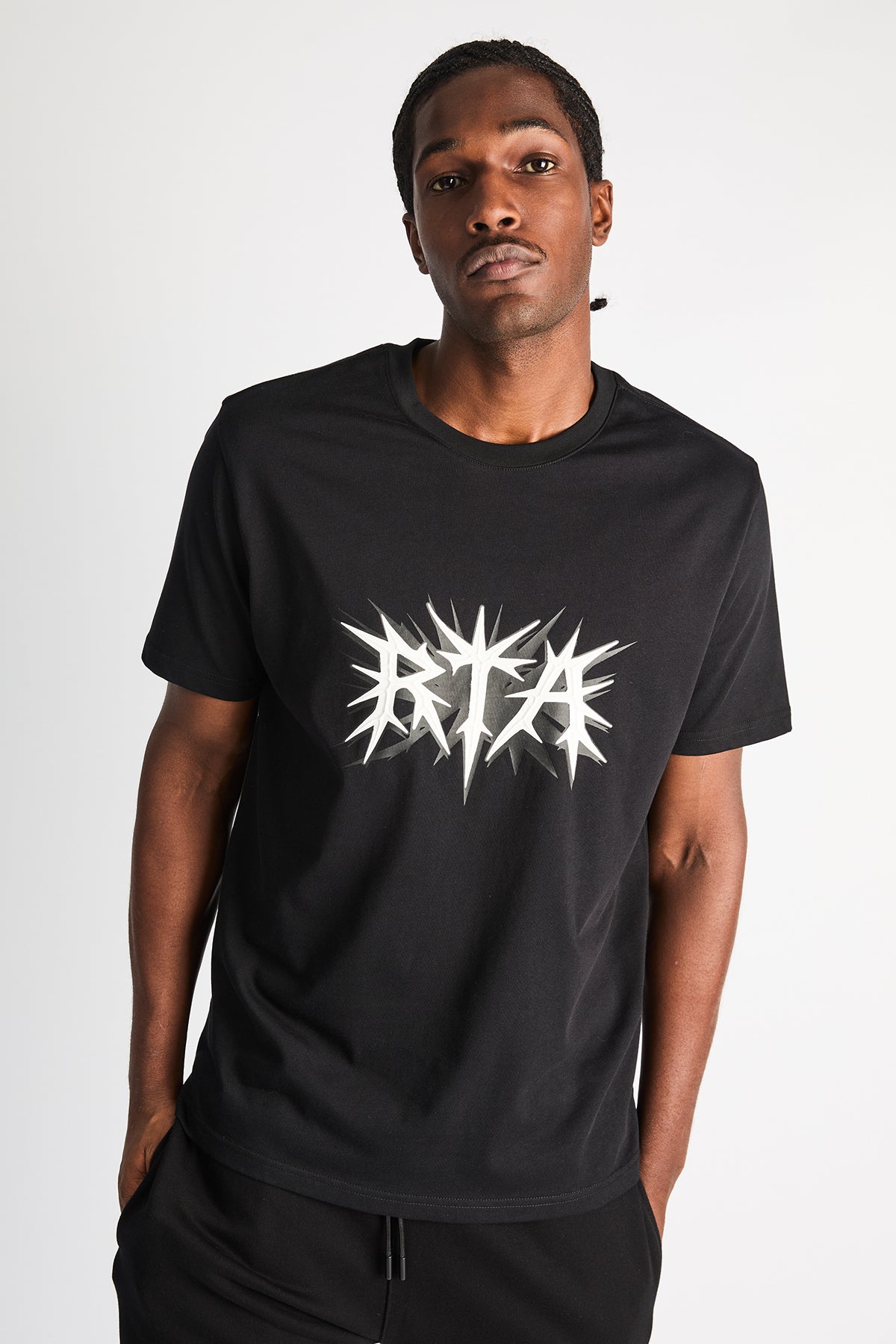 Black Cotton Liam Spike Logo Tee - Studio On Model | RTA
