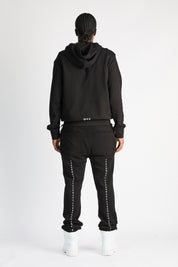 Black Owen Sweatpants with Cross Details on Model - Back Styled Look | RTA