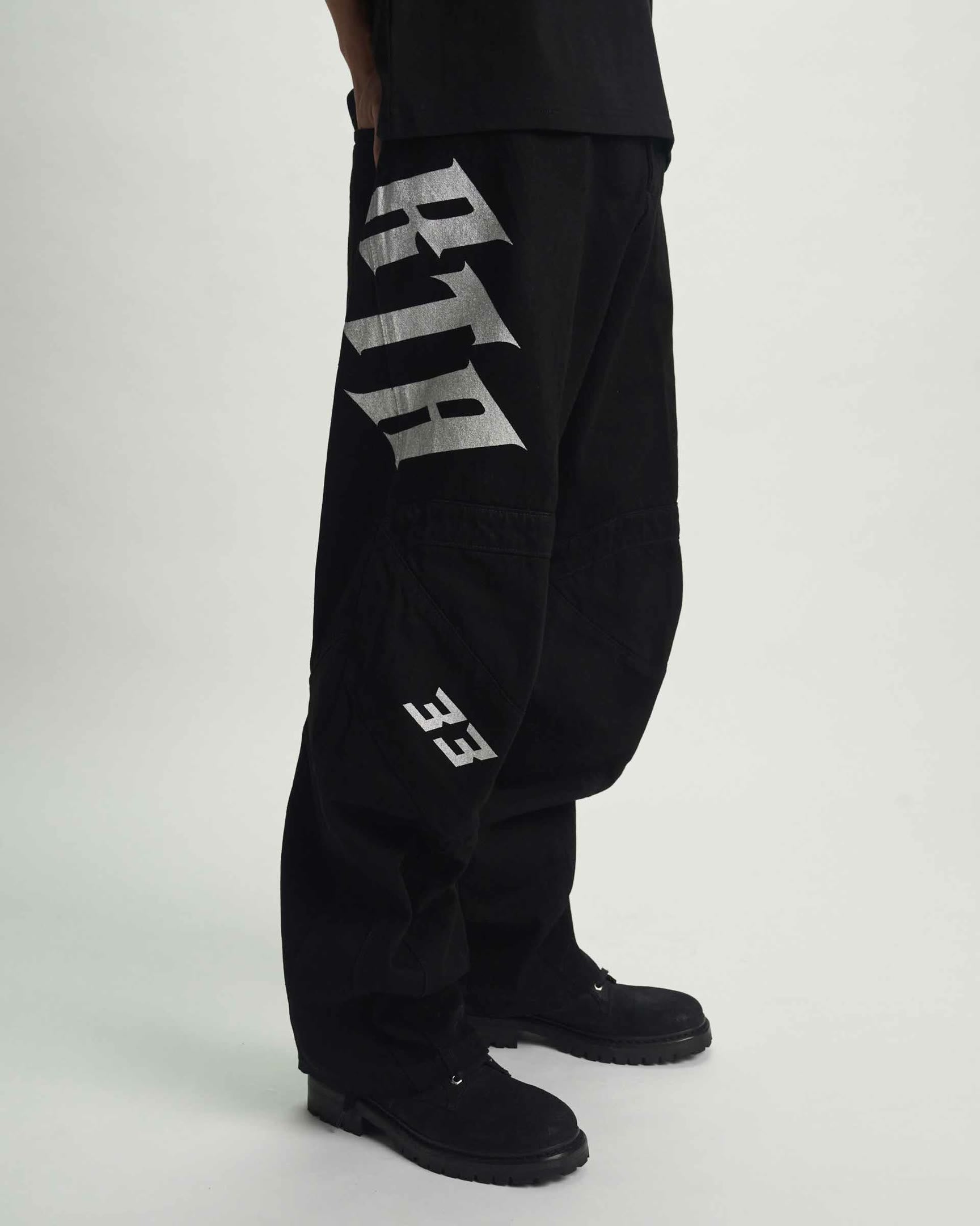 Black Alwin Moto Jean - Side Detail, Old English Graphic and Moto Knee Panel | RTA