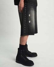 Black Baggy Denim Short with Silver Side Cross Detail On Model - Side Profile | RTA