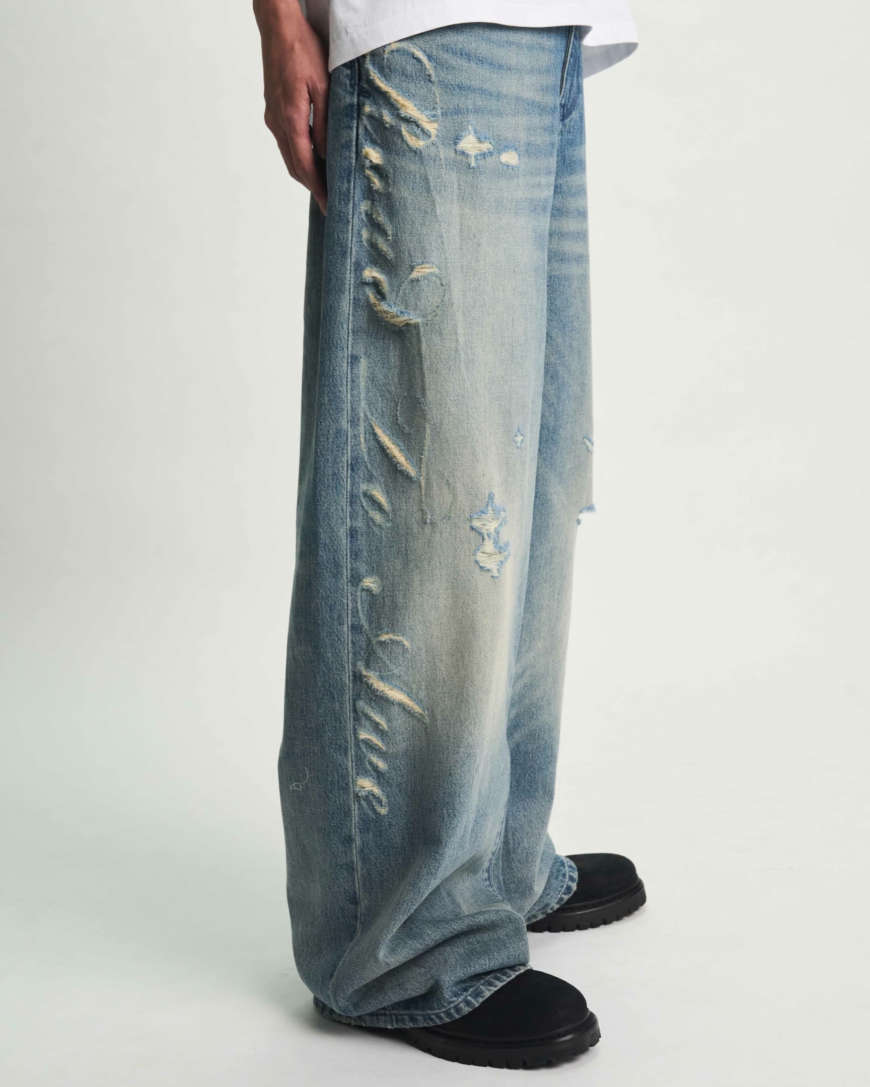 Golden Indigo Laser Wide Leg Jean - Side Close-Up Laser Script Detail | RTA