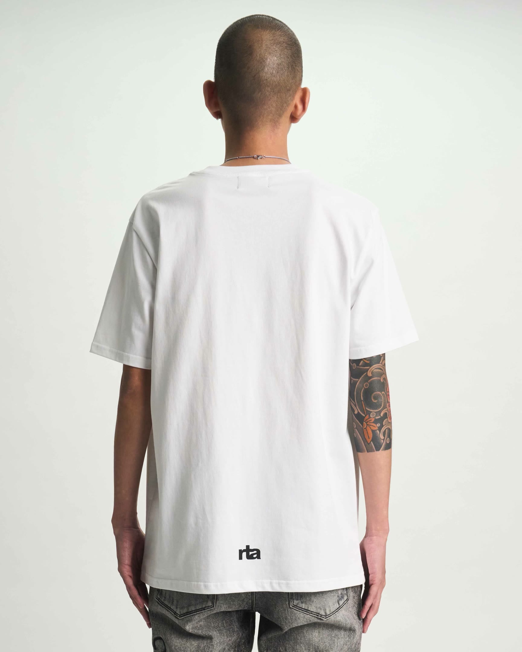 White Cotton Liam Tee - On Model Back View with RTA Logo | RTA