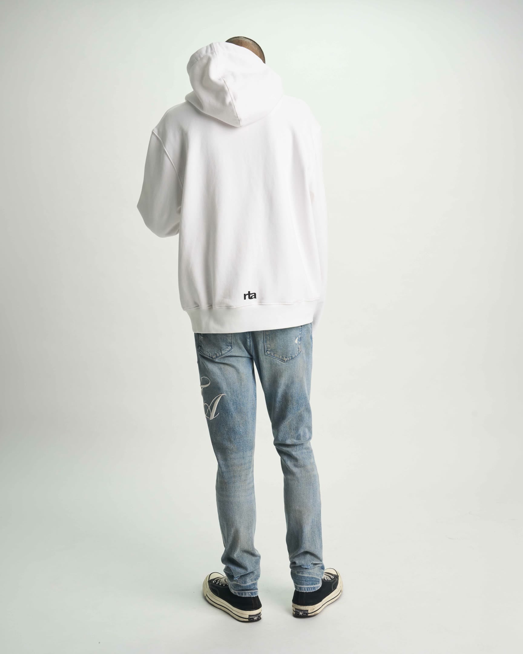 Light Blue Bryant Skinny Jeans with White Hoodie - Full Outfit Back View | RTA