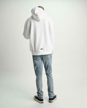 Light Blue Bryant Skinny Jeans with White Hoodie - Full Outfit Back View | RTA