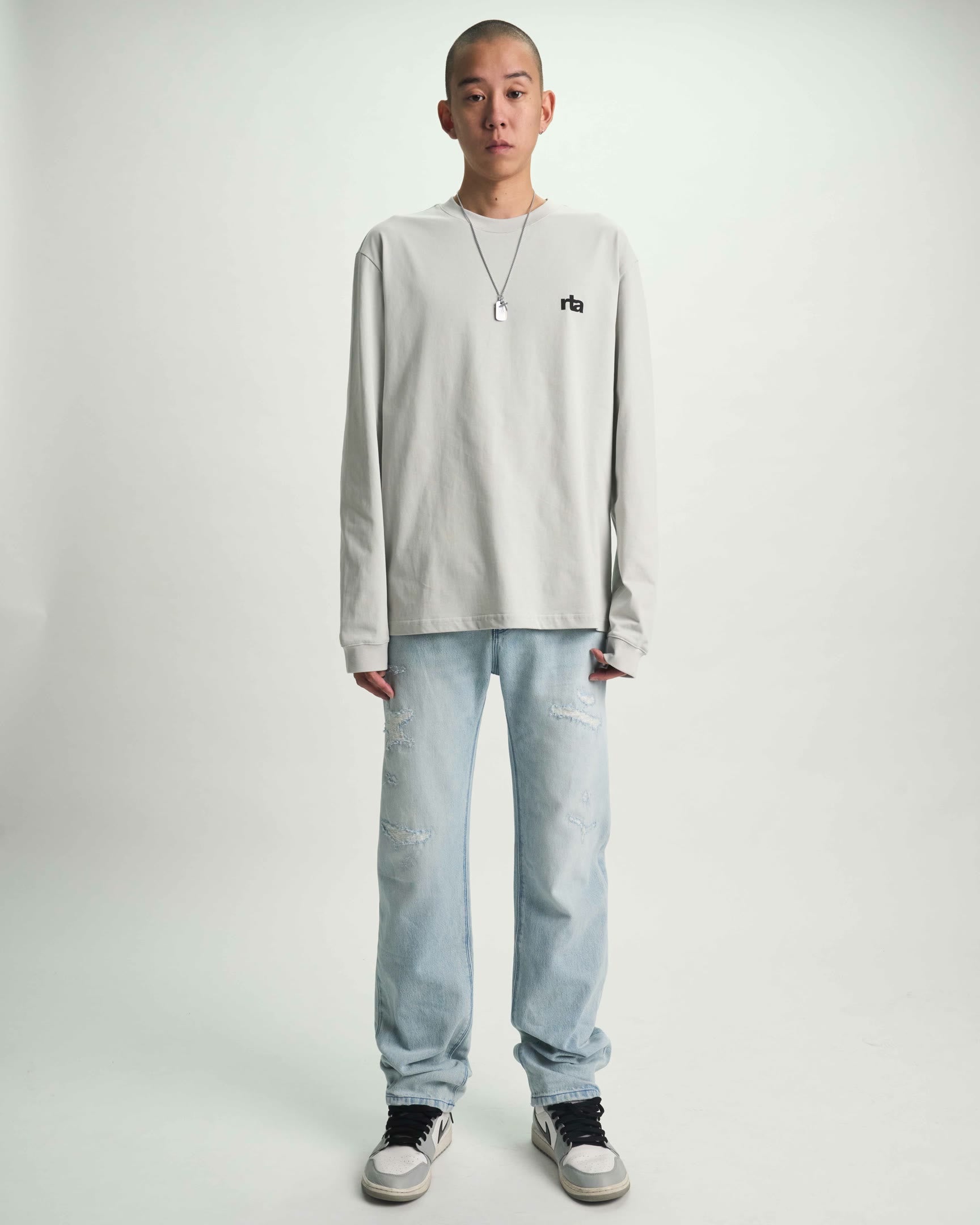 Light Blue Distressed Slim Jeans - On Model Full Length Front View | RTA