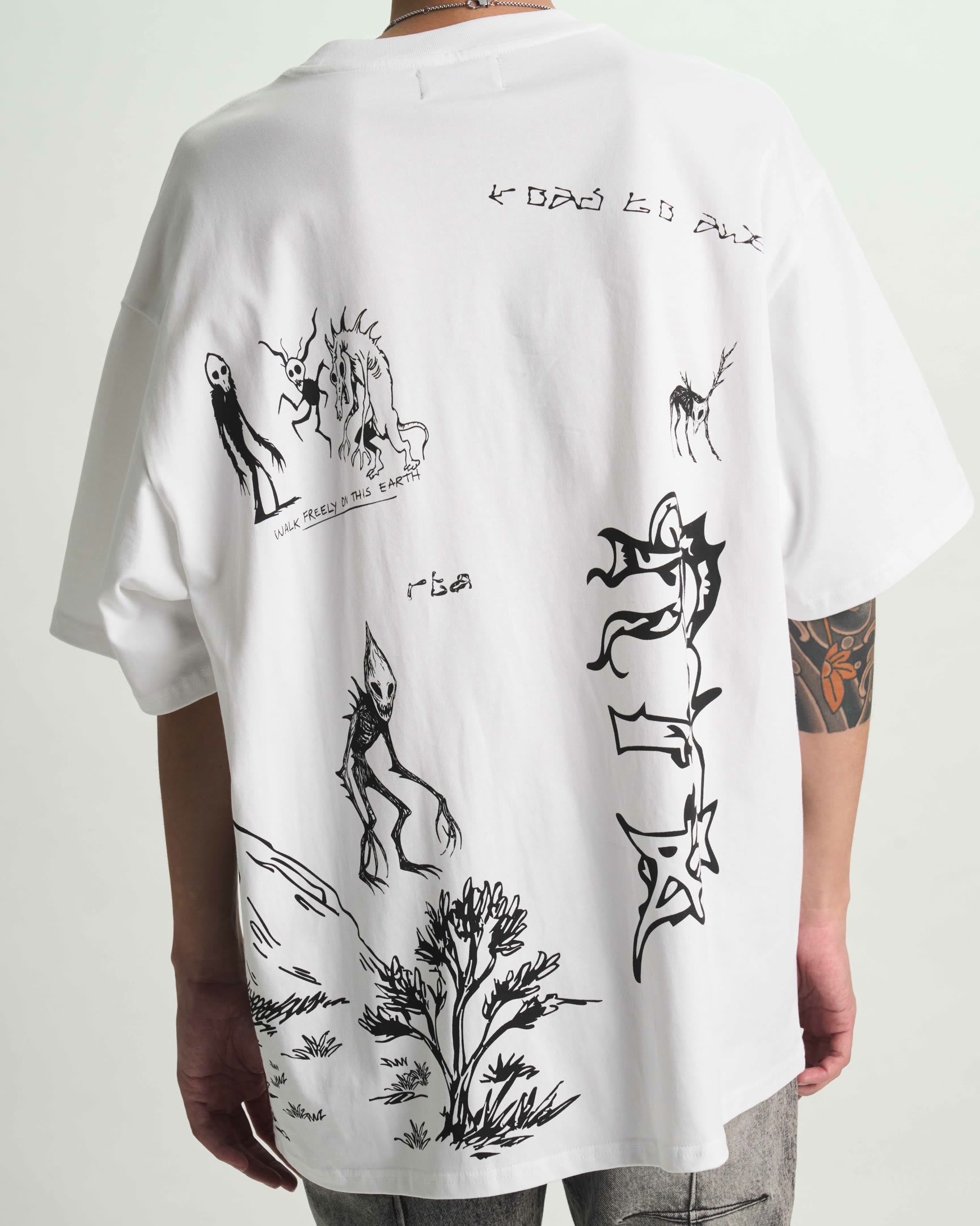 White Cotton Oversized Graphic Tee - On Model Back View, Creature Scenery Print | RTA