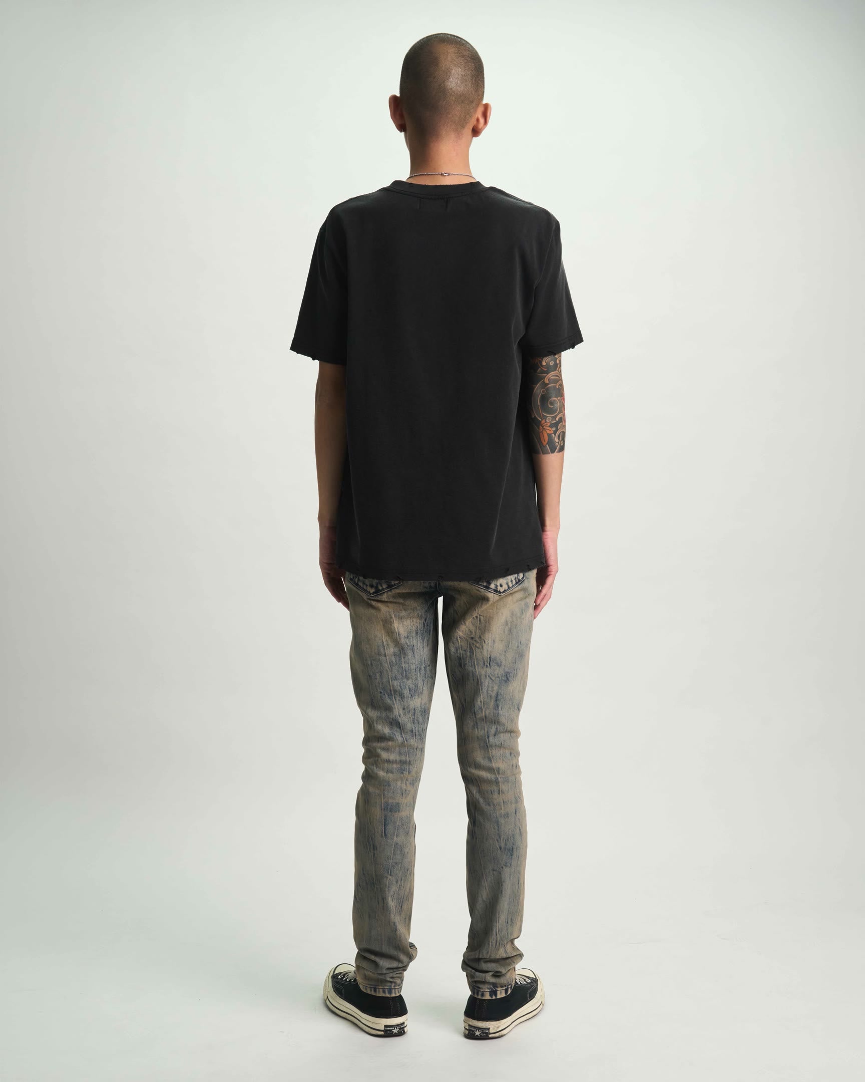 Black Liam Tee On Model - Back View, Rebellious Streetwear Styling | RTA