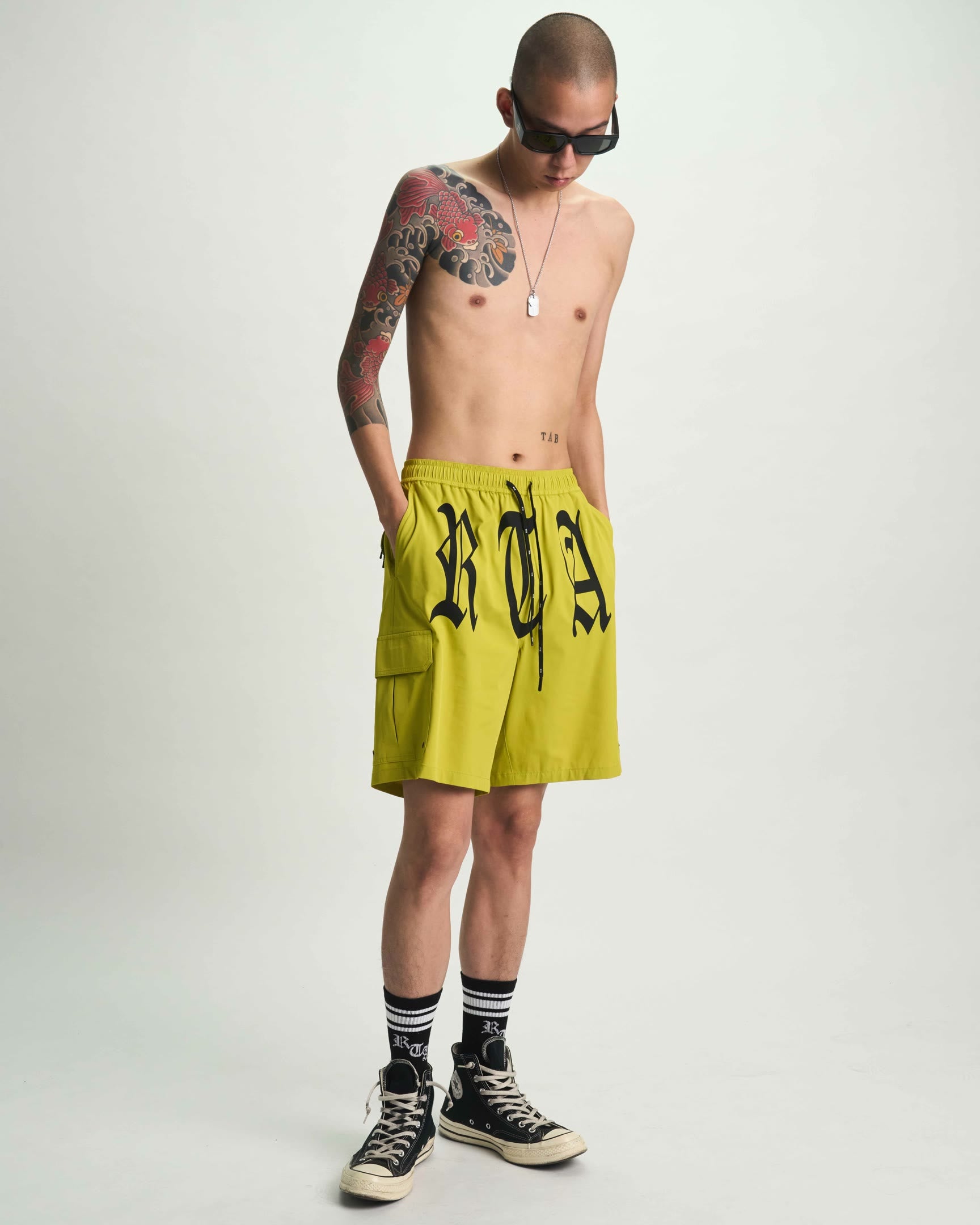 Citron Miguel Swim Trunk with Old English RTA Print - On Model Front | RTA