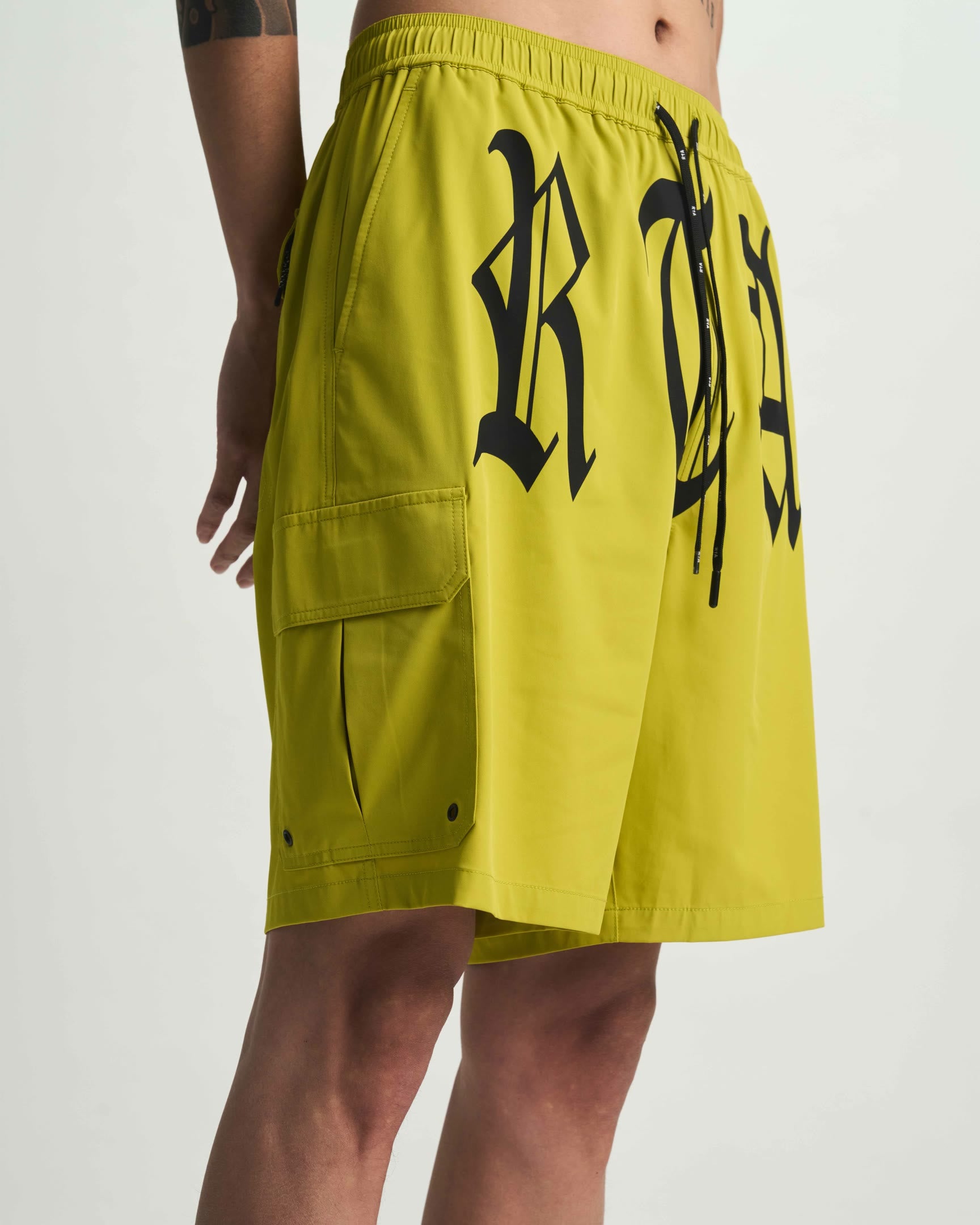 Citron Miguel Swim Trunk Side Profile with Old English Graphics - On Model | RTA