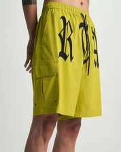 Citron Miguel Swim Trunk Side Profile with Old English Graphics - On Model | RTA