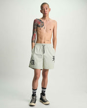 Light Teal Mark Swim Trunks with Gothic Branding - On Model Front | RTA