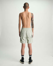 Light Teal Designer Swim Shorts with Old English Graphics - Model Back | RTA