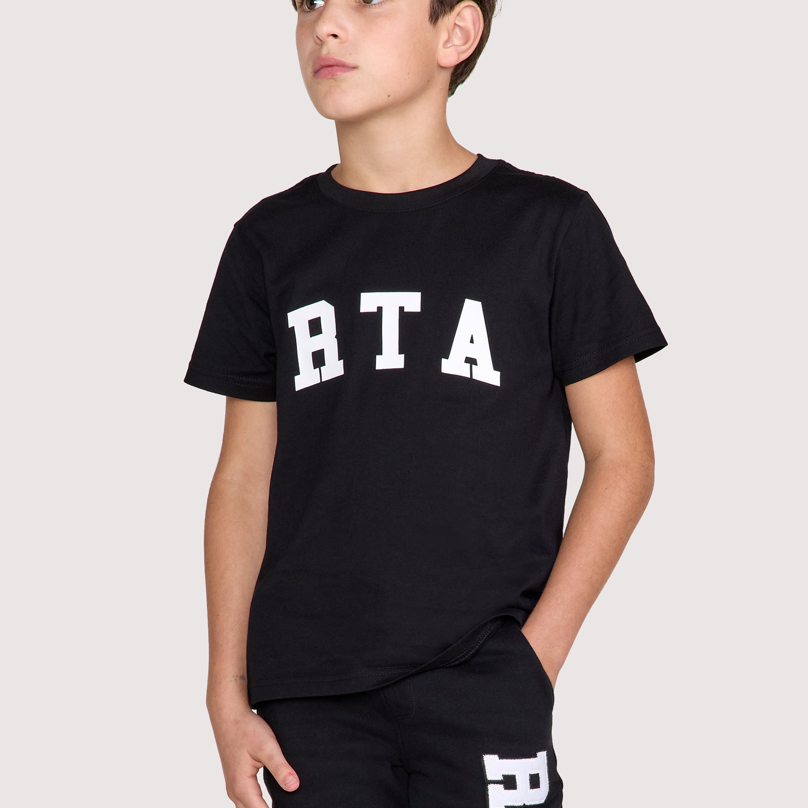 Black Cotton Kids Lawson Tee with White RTA Logo - On Model Front View | RTA