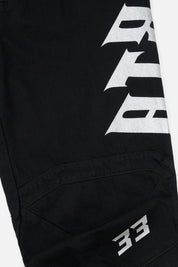 Black Alwin Moto Jean - Graphic Close-Up, Old English Logo and Moto Panel Detail | RTA