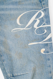 White Cursive Graphics Detail on Light Blue Denim - Close Up | RTA