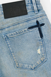 RTA Leather Patch with Black Cross Detail on Light Blue Jeans - Hardware Detail | RTA