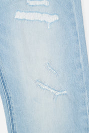 Light Blue Distressed Denim Close-Up - Ripped Fabric Texture Detail | RTA