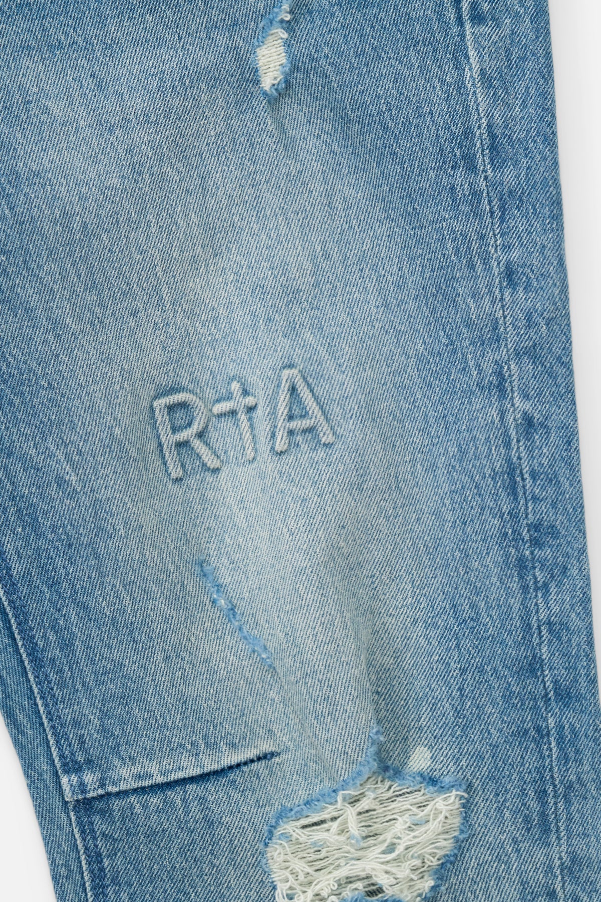 Golden Indigo Denim RTA Logo Embroidery Detail - Close Up | RTA