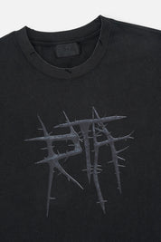 Black RTA Thorn Tee - Close-Up Neckline Label and Graphic Detail | RTA