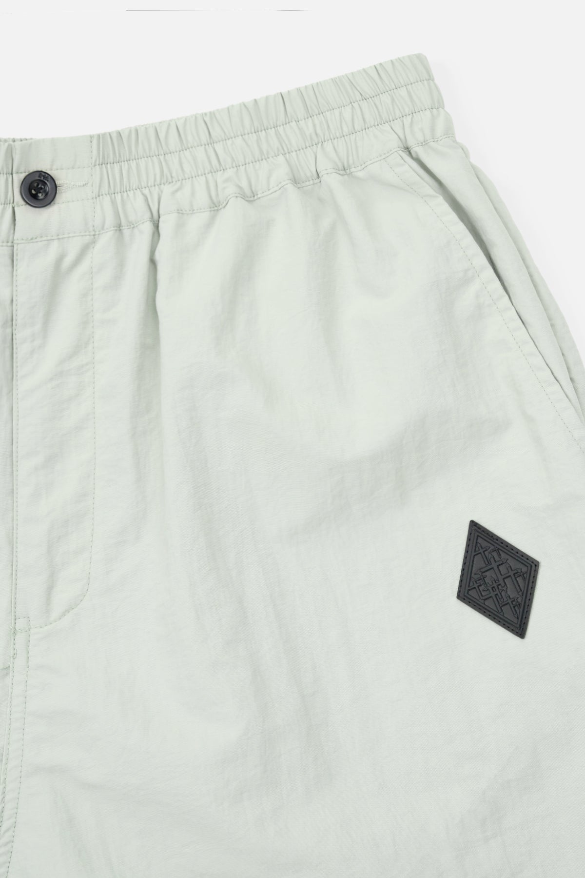 Zaid Parachute Pant Waistband and Logo Patch Close-Up Detail | RTA