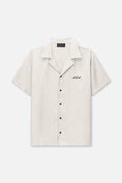 Beige Nathan Short Sleeve Shirt with Black Embroidered Logo - Front View Flat Lay | RTA