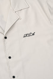 Beige Nathan Short Sleeve Shirt - Front Logo Embroidery Close-Up Detail | RTA