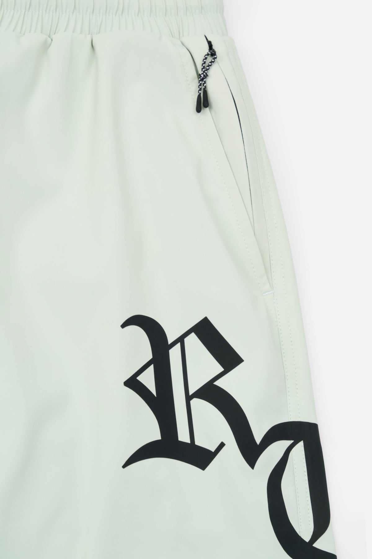 Light Teal Swim Shorts Side Panel with Gothic RTA Logo Detail | RTA
