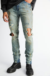 RTA Bryant Skinny Jean Indigo Rust - On Model Close-Up Front, Destroyed Knee Detailing | RTA