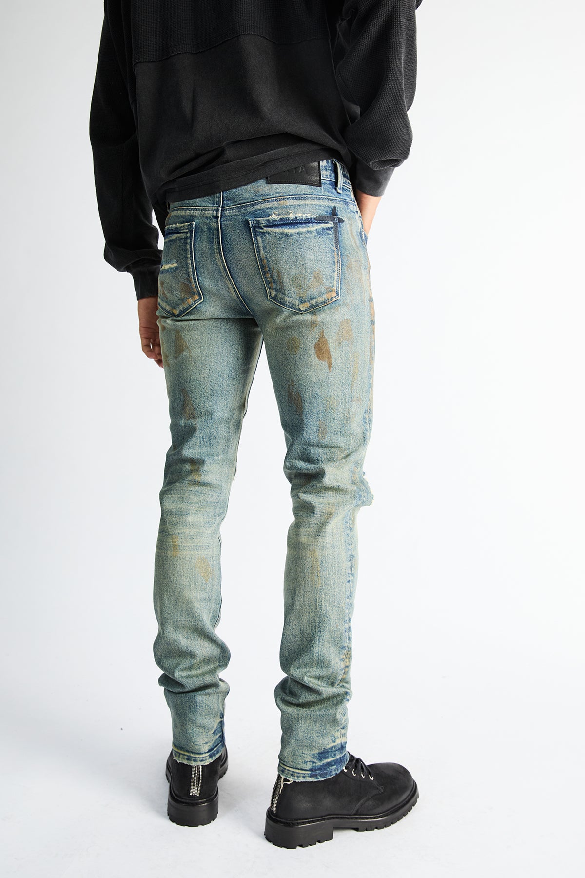 RTA Bryant Skinny Jean Indigo Rust - On Model Back View, Rust-Tinted Distressed Denim | RTA