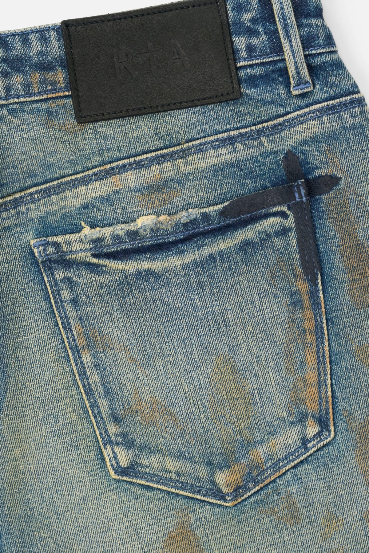 RTA Bryant Skinny Jean Indigo Rust - Leather Patch and Dagger Hardware Back Pocket Detail | RTA