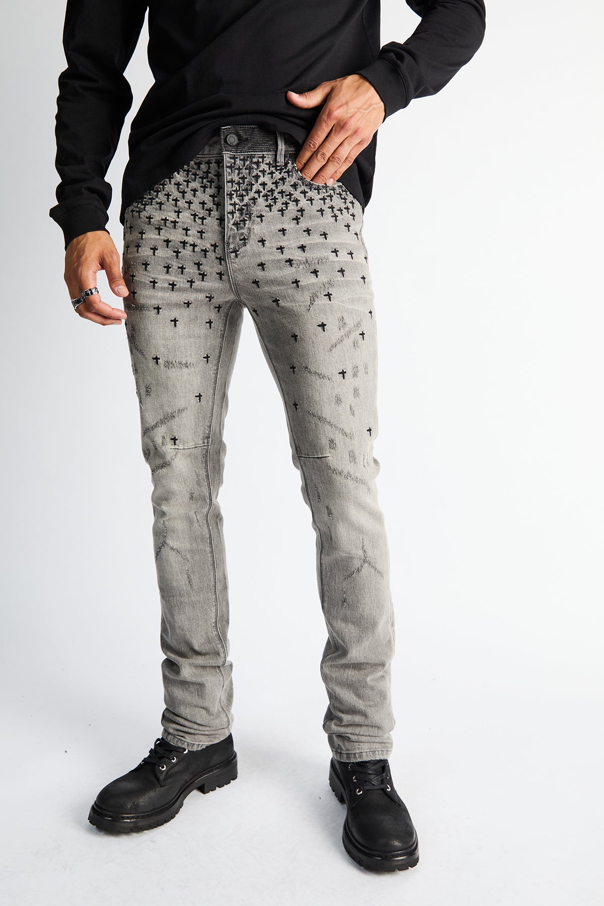 RTA Olivier Skinny Jean Smoky Rinse - On Model Front Close-Up, Allover Cross Motif Grey Denim | RTA