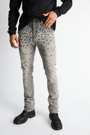 RTA Olivier Skinny Jean Smoky Rinse - On Model Front Close-Up, Allover Cross Motif Grey Denim | RTA