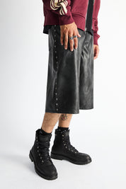 Gustavo Bermuda Shorts Vintage Black - Close-Up Cross Rivet Side Detail, On Model | RTA