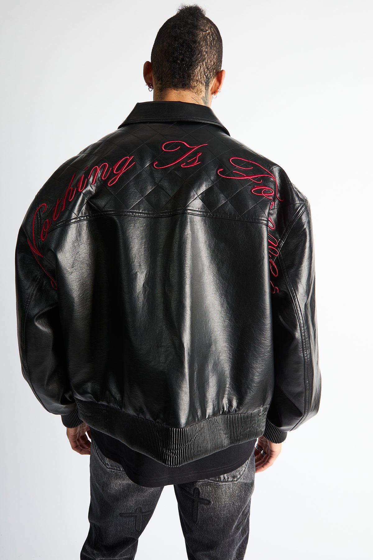 RTA Evander Oversized Bomber Black - Back View, Red Script Embroidery on Quilted Panel, Ribbed Hem | RTA