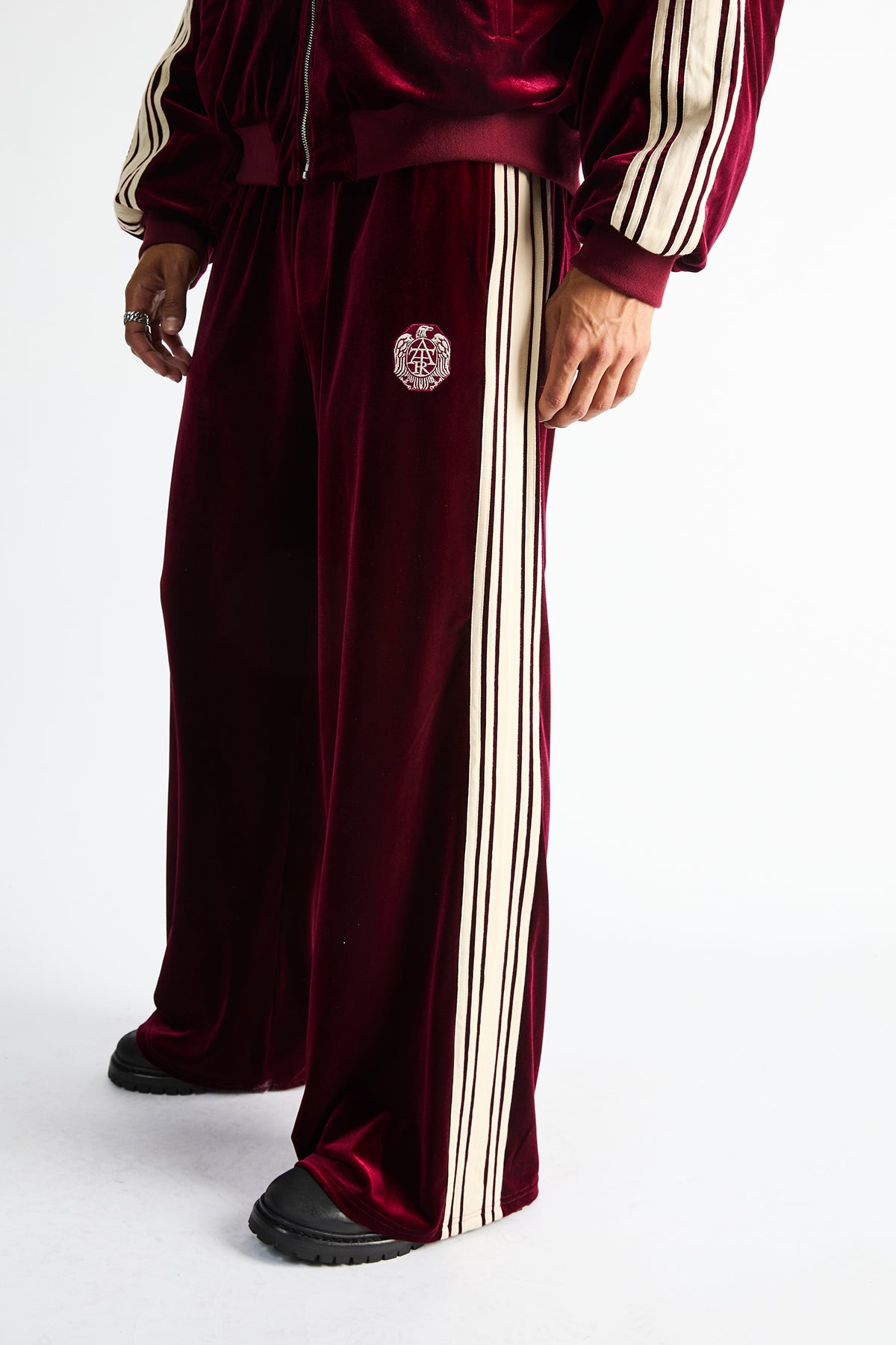 Luxen Baggy Sweatpants Burgundy Crest - Close-Up Crest Embroidery and Side Stripe Detail | RTA