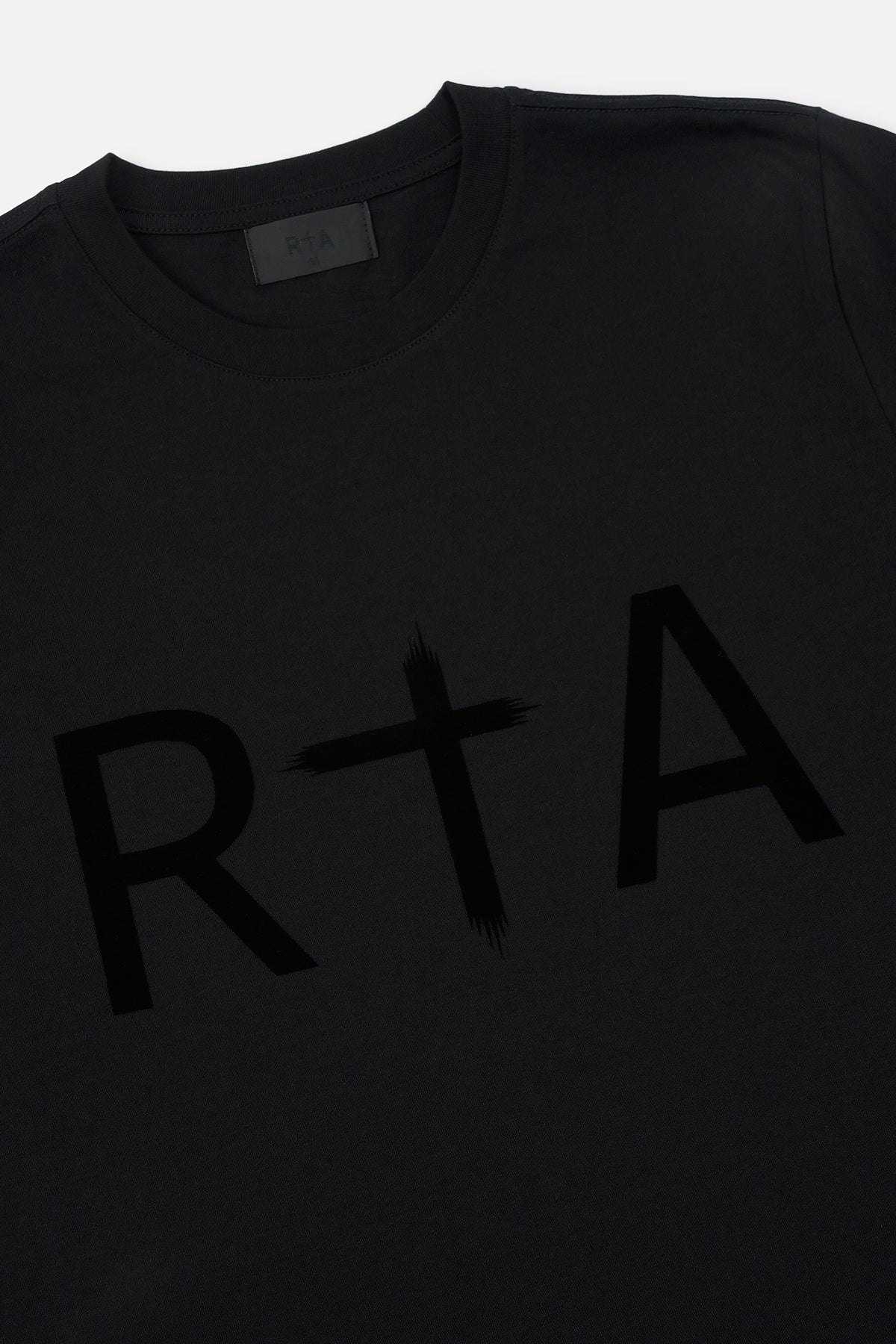 Black Cotton Tee Flocked RTA Logo Close-Up Detail View | RTA