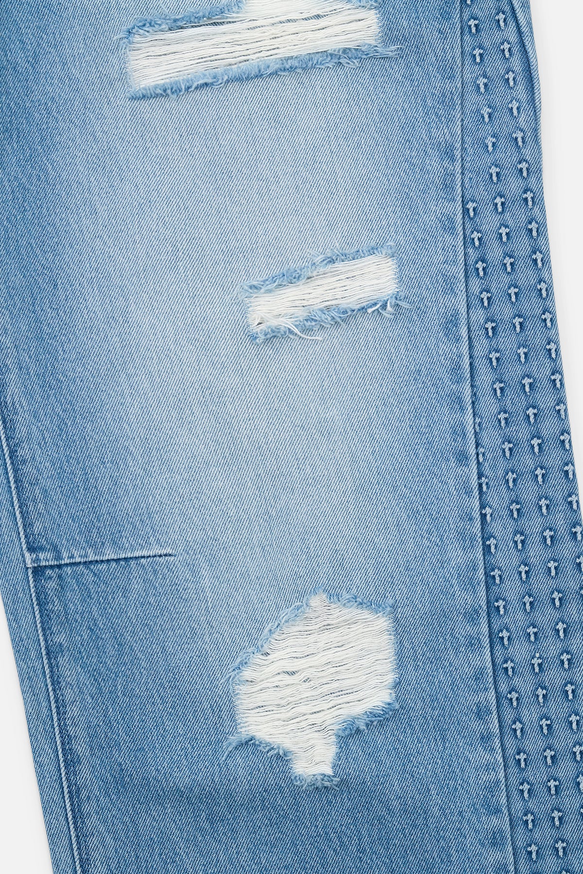 Distressed Denim Jeans with 3D Cross Embossed Side Seam Details - Close Up | RTA