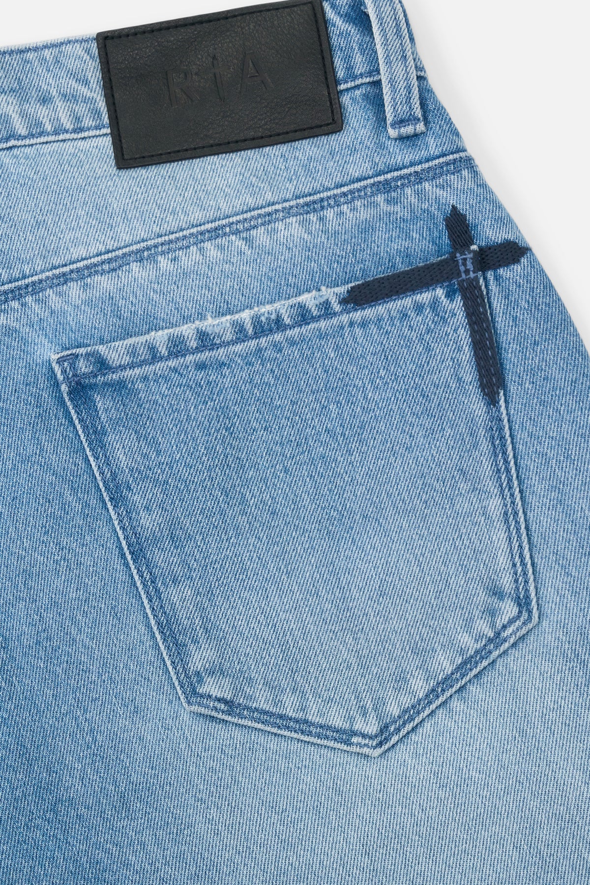 RTA Cross Embroidered Back Pocket Detail on Glacier Blue Denim Jeans | RTA