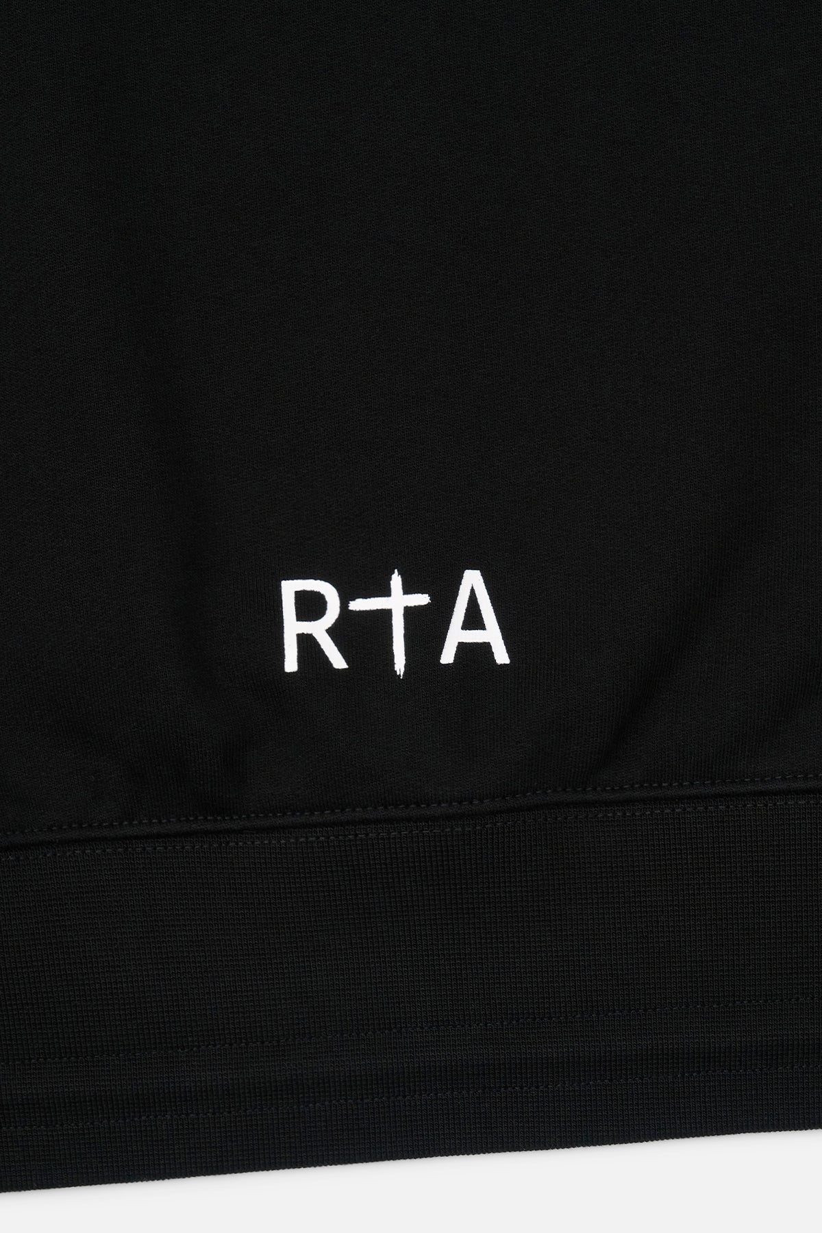 RTA Logo Detail on Black Cotton Hoodie Hem - Bottom Close-up | RTA