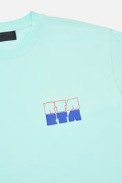 Turquoise Cotton Colin Oversized Tee RtA Stacked Logo Detail - Close Up View | RTA