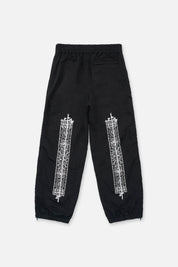 Black Paisley Track Pants with Cross Graphics - Back View | RtA